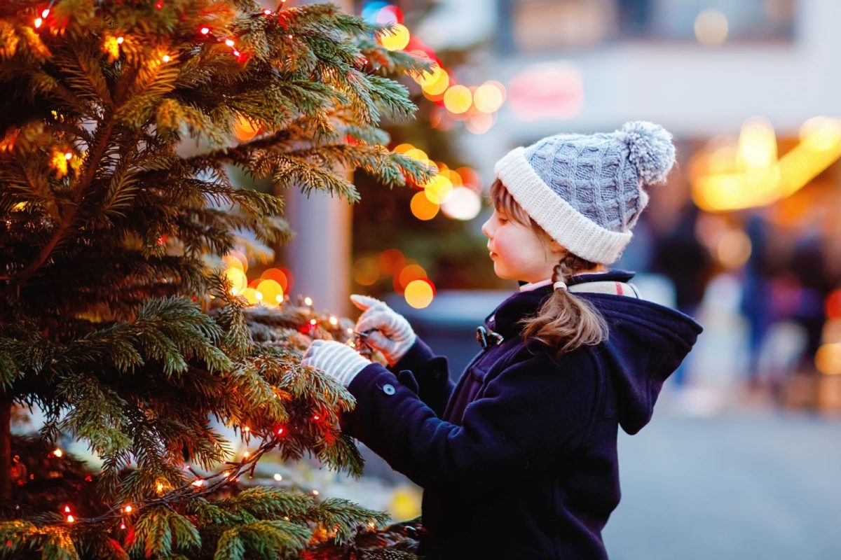 little girl with Christmas tree