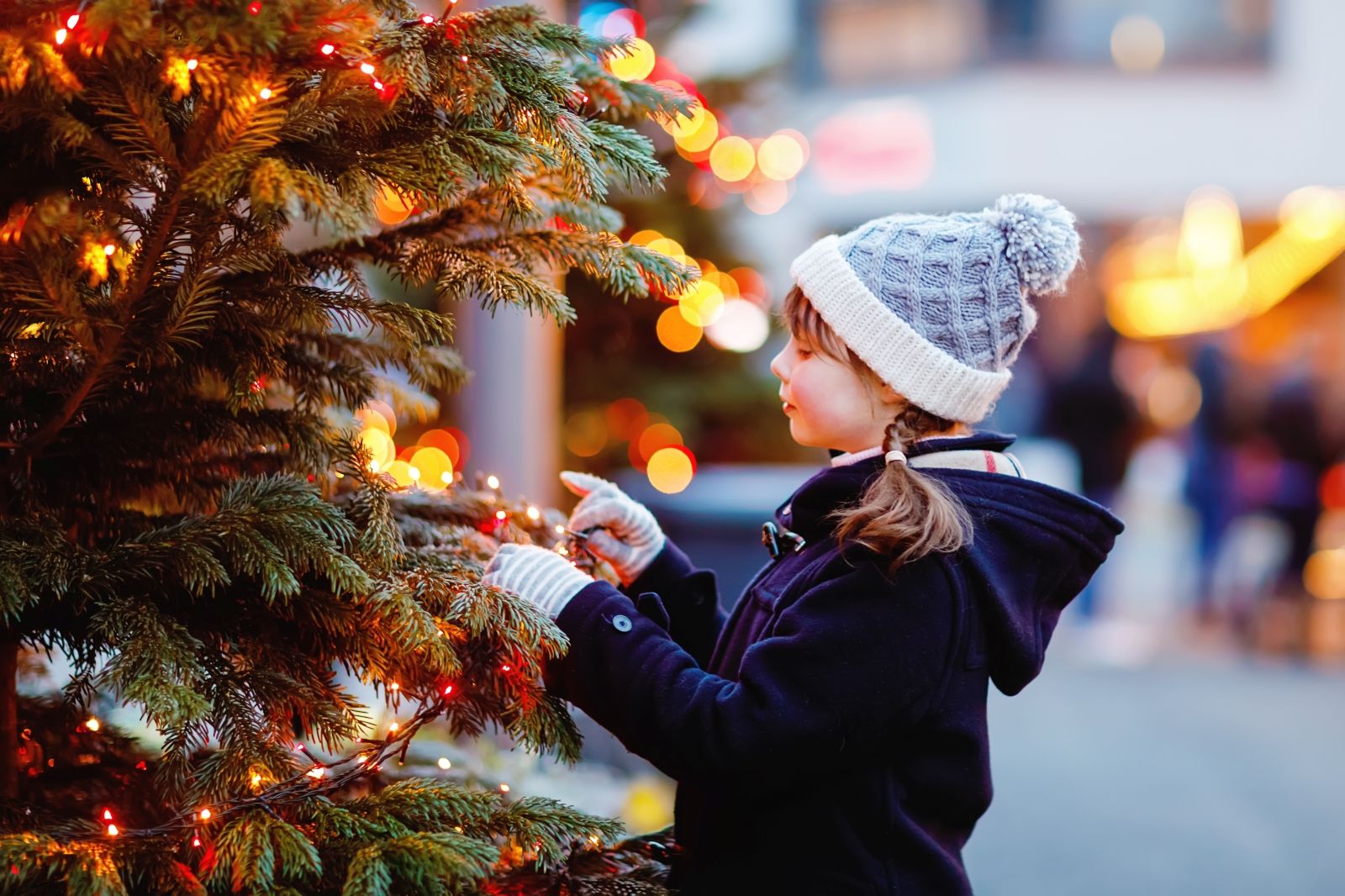 little girl with Christmas tree